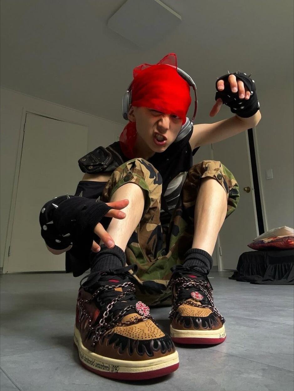Inferno with camouflage shorts, photographed indoors