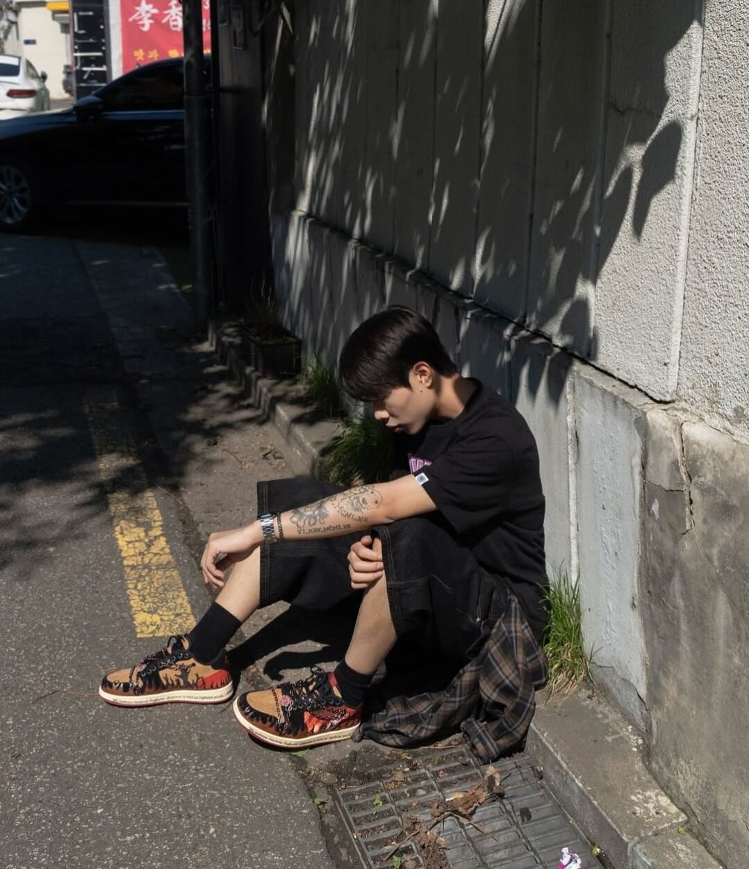 Inferno with a black outfit, seated outside