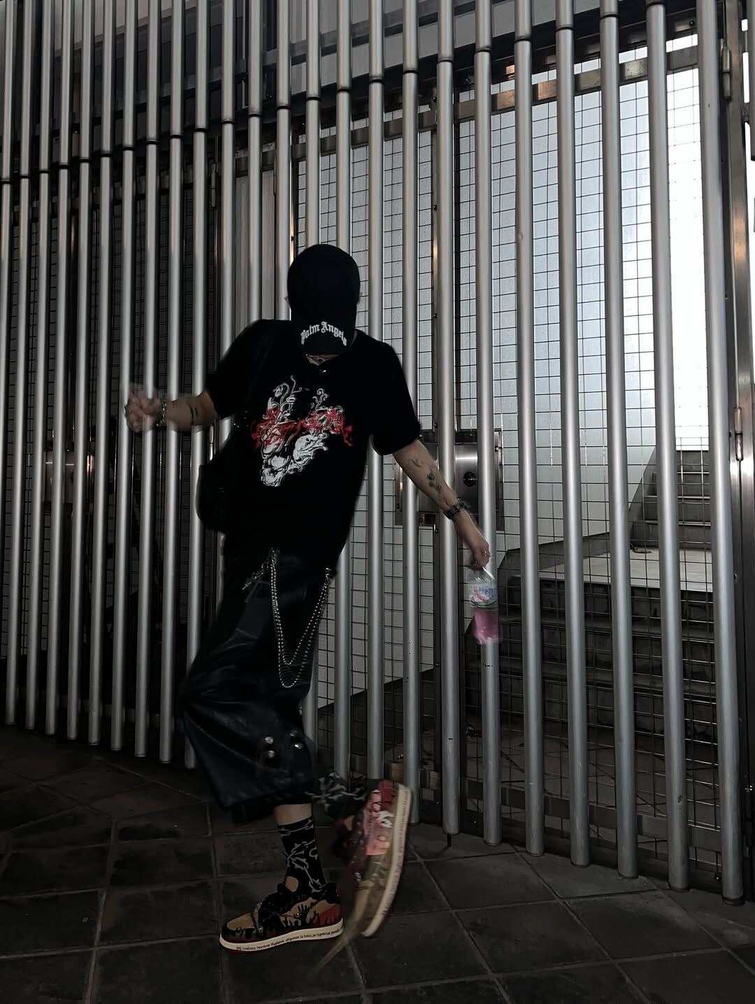 Full outfit with Inferno, black graphic tee, cap and chains