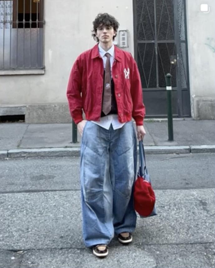 Inferno with a red jacket and wide-leg jeans
